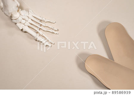 Orthopedic insoles for shoes on a colour background. Foot care Orthopedic insoles for shoes on a colour background. Foot care 89586939