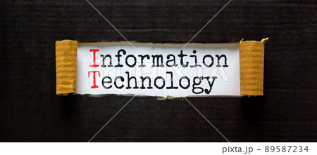 IT information technology symbol. Concept words IT information technology on white paper. Beautiful black background. Business IT information technology concept, copy space. IT information technology symbol. Concept words IT information technology on white paper. Beautiful black background. Business IT information technology concept, copy space. 89587234