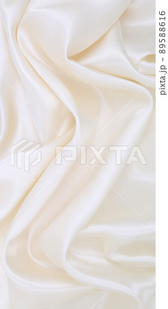 Smooth elegant white silk or satin luxury cloth texture as wedding background. Luxurious background design Smooth elegant white silk or satin luxury cloth texture as wedding background. Luxurious background design 89588616