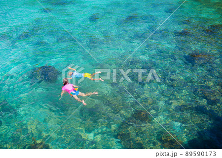 Kids snorkel. Children snorkeling in tropical sea. 89590173