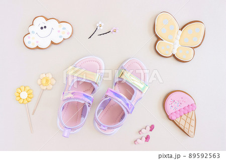 Stylish holographic sandals for kids on grey background. Shiny fashion summer shoes. Flat lay, Top view 89592563