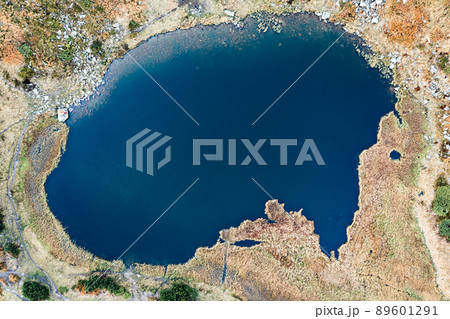 Lake Nesamovite mountain lake of the Ukrainian Carpathians, a lake in autumn. 89601291