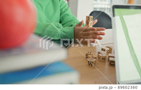 African American student doing activity playing block wooden for development together with enjoy and fun in the classroom. 89602360