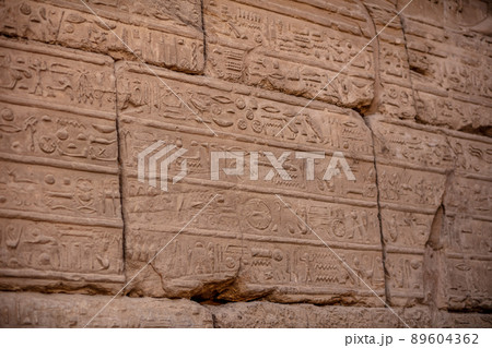 Different hieroglyphs on the walls and columns in the Karnak temple. Karnak temple is the largest complex in ancient Egypt. Different hieroglyphs on the walls and columns in the Karnak temple. Karnak temple is the largest complex in ancient Egypt. 89604362
