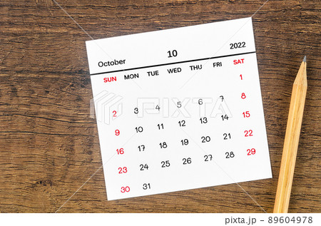 October 2022 calendar and wooden pencil on vintage wooden background. October 2022 calendar and wooden pencil on vintage wooden background. 89604978