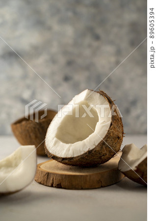 Coconut fresh nut fruit pieces on bright background 89605394