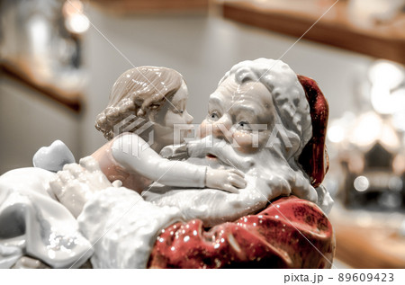 Santa Claus with kid figurine. 89609423
