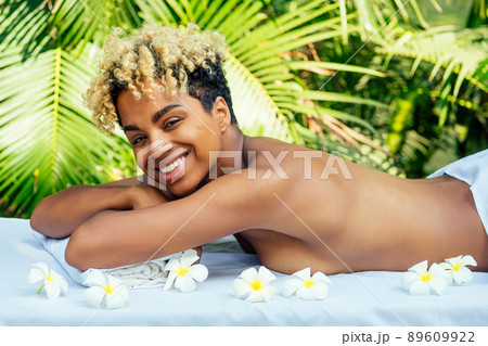 attractive african american female get treatment massage in tropics resort outdoor salon attractive african american female get treatment massage in tropics resort outdoor salon 89609922