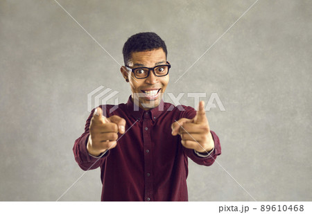 Portrait of happy black man smiling and doing You're Right or I Choose You gesture 89610468