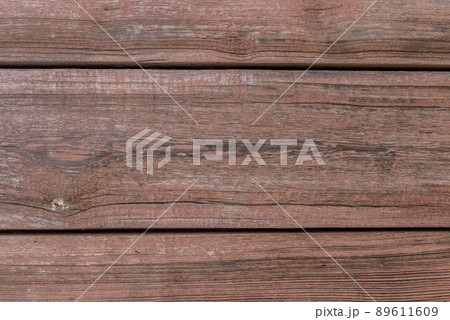 Old wooden worn fence boards weathered texture brown dirty obsolete plank background 89611609