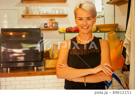 small business cafeteria owner tropical eco style look at camera and smile 89612251
