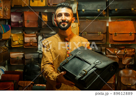 egypt sallerman showing his bags at arambol goa market 89612889