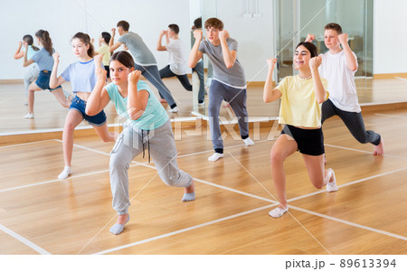Boys and girls learn to dance modern dances in studio 89613394