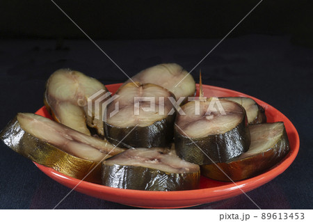 Pieces of smoked mackerel on a plate 89613453