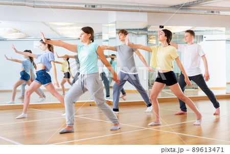 Teenage dancers practicing new dance in studio 89613471
