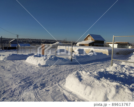 Winter landscape in a Russian village on a sunny day Winter landscape in a Russian village on a sunny day 89613767