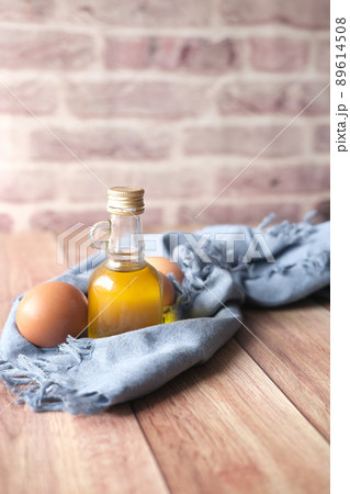 egg and cooking oil on table egg and cooking oil on table 89614508