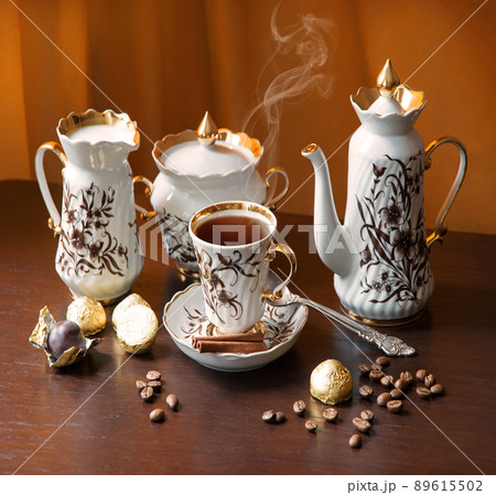Sweets on the background of coffee still life Sweets on the background of coffee still life 89615502