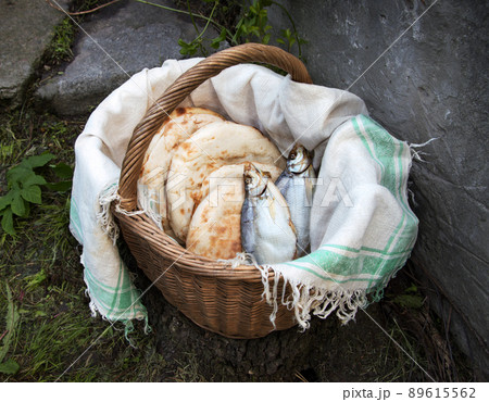 Five loaves and two fish in basket 89615562