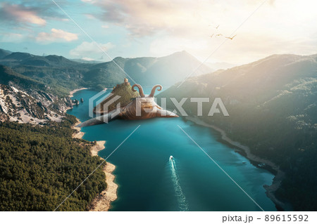 A giant sea turtleis swiming in a potemic between mountains. Unrealistic fantasy and nature concept 89615592