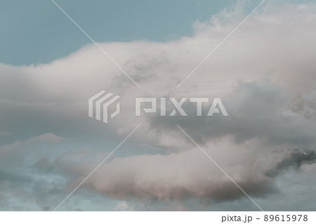 Blue sky with puffy clouds for background. Atmospheric phenomena in formation of precipitation. 89615978