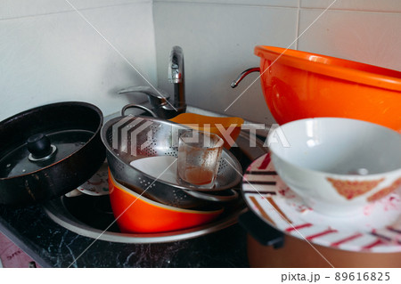 huge heap of dirty dishes waiting for the washing 89616825