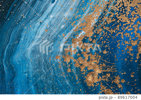 Fluid Art acrylic paints. Abstract mixing blue paint waves. Liquid golden flows splashes. Marble effect background or texture 89617004