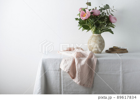 Elegant pink linen runner on the white tablecloth Elegant pink linen runner on the white tablecloth 89617834