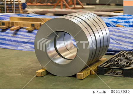 Roll of steel sheet in a plant. Rolls of sheet steel of Factory. Coils of steel stripes in store Roll of steel sheet in a plant. Rolls of sheet steel of Factory. Coils of steel stripes in store 89617989