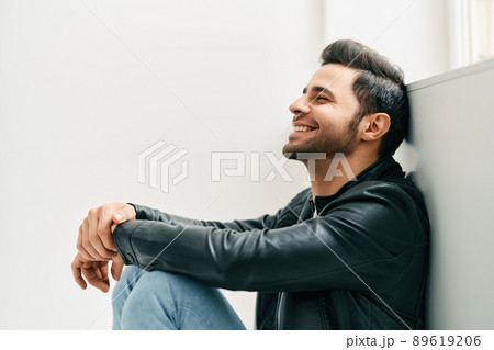 Portrait of happy smiling man posing on studio white background 89619206