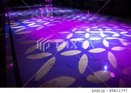 Light pattern on a dark dance floor created by professional lighting equipment Light pattern on a dark dance floor created by professional lighting equipment 89621747
