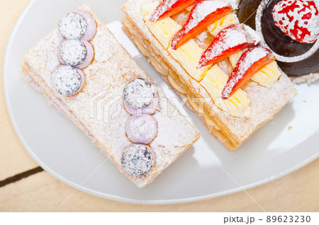 selection of fresh cream cake dessert plate 89623230