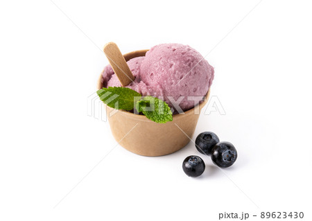 Blueberry ice cream scoop in paper cup isolated on white background 89623430