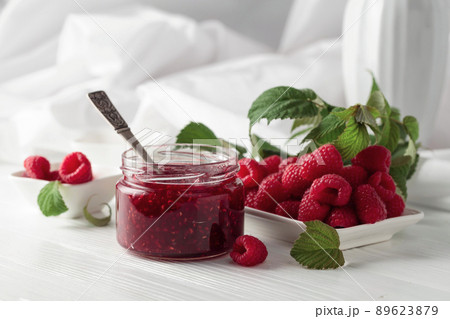 Jar of raspberry jam and fresh berries. Jar of raspberry jam and fresh berries. 89623879