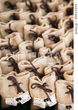 Many small brown bags of fabric Many small brown bags of fabric 89623944