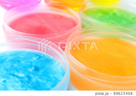 Colorful slimes in plastic containers, closeup. Antistress toy 89625408