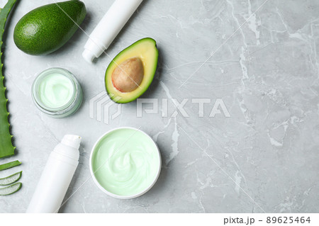 Flat lay composition with jars of cream on marble background. Space for text Flat lay composition with jars of cream on marble background. Space for text 89625464