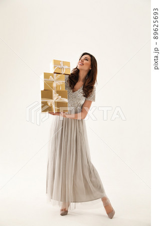 Beautiful woman with Christmas gifts on white background Beautiful woman with Christmas gifts on white background 89625693