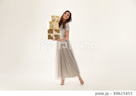 Beautiful woman with Christmas gifts on white background Beautiful woman with Christmas gifts on white background 89625855