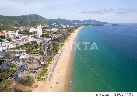 Aerial Drone shot of tropical sea Beautiful waves crashing on sandy shores at karon beach in phuket thailand 89627400