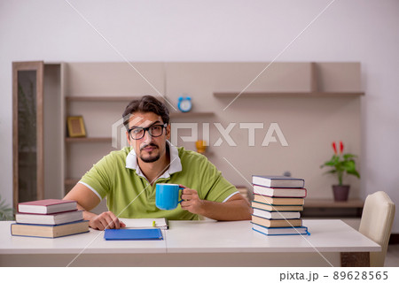 Young male student studying at home 89628565