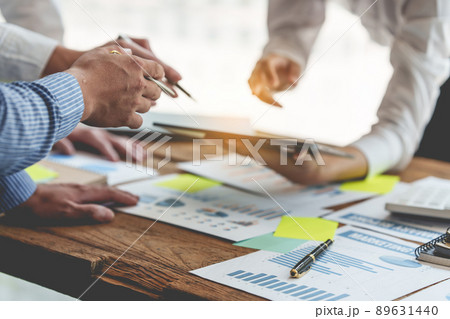 Group of IT consultant working by digital tablet and management big data and analyze financial document of company. Group of IT consultant working by digital tablet and management big data and analyze financial document of company. 89631440