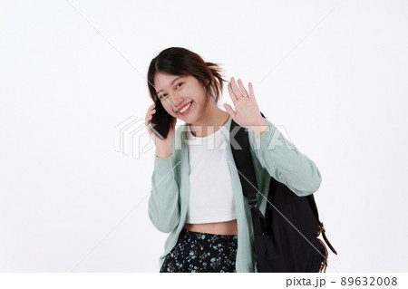 Young college student with backpack isolated over white background. E-learning ,online ,education concept. Young college student with backpack isolated over white background. E-learning ,online ,education concept. 89632008