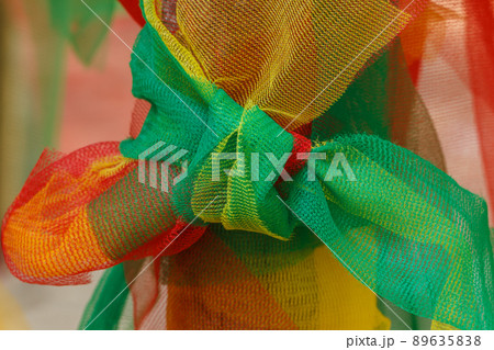 Multicolor Fabric texture tied to tree 89635838