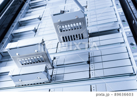 detail of data storage hardware that is undergoing maintenance, view from down detail of data storage hardware that is undergoing maintenance, view from down 89636603