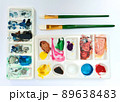 Flat lay sketchbook, watercolor brushes and color palette 89638483