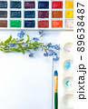 Flat lay sketchbook, watercolor brushes and color palette 89638487
