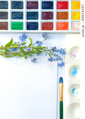 Flat lay sketchbook, watercolor brushes and color palette 89638487