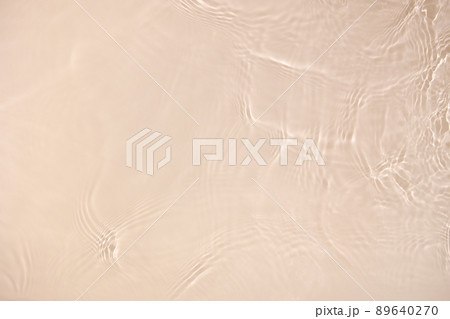 transparent beige colored clear calm water surface texture  89640270