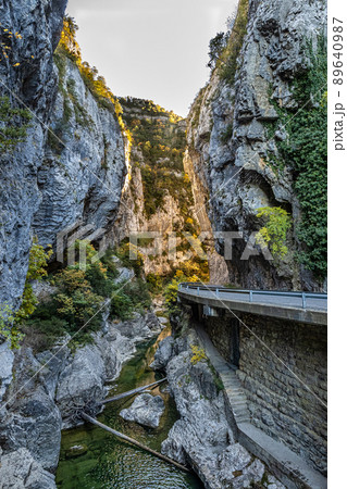 Driving through Foz de Arbayun canyon of Salazar River in the Pyrenees in Spain Driving through Foz de Arbayun canyon of Salazar River in the Pyrenees in Spain 89640987